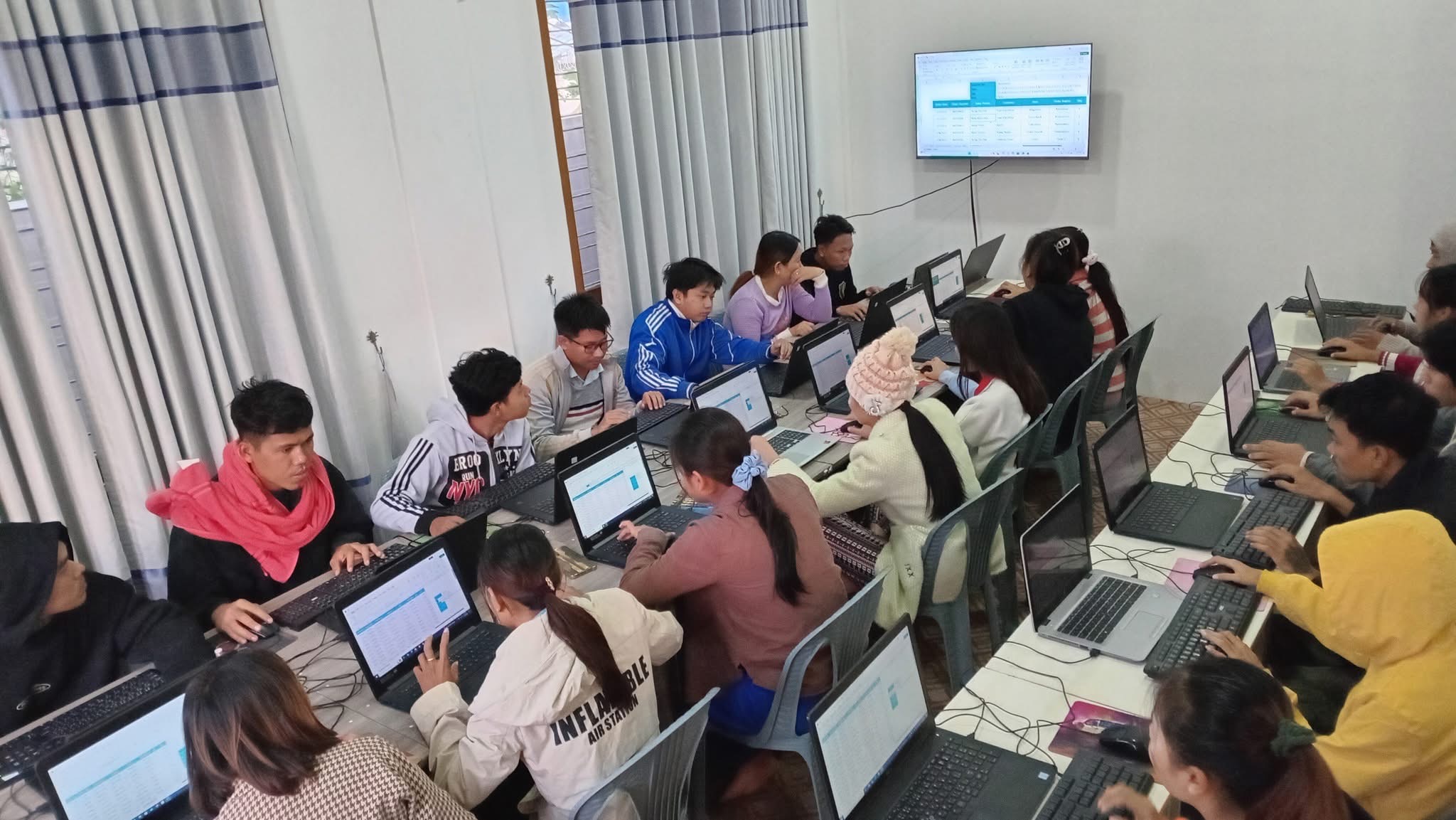 Students learning at a Next Technology Services training session